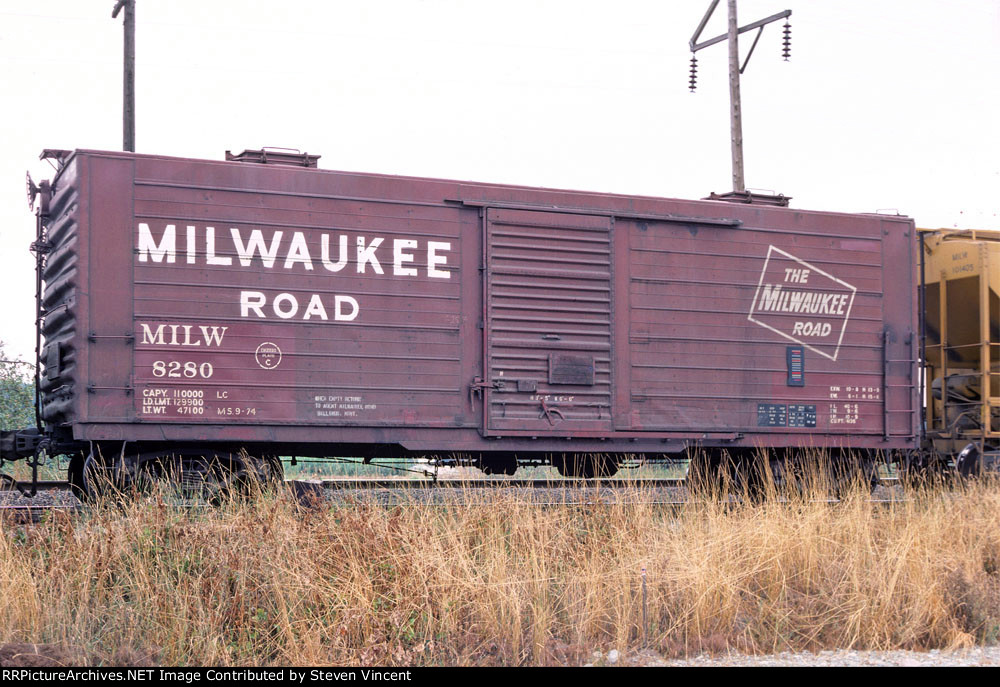 Milwaukee Road box with roof hatches MILW #8280 in company sand service.